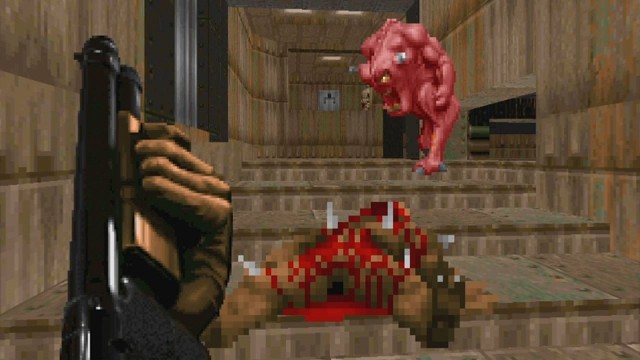 Screenshot from Doom. Blood, guts, and a bright pink demon baying for blood.